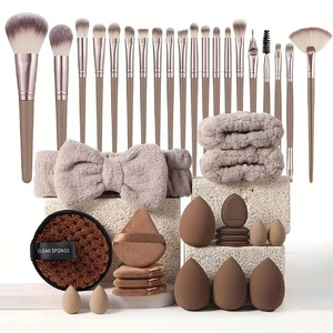 Detailed set of 40 makeup tools including brushes, headbands, and blending sponges
