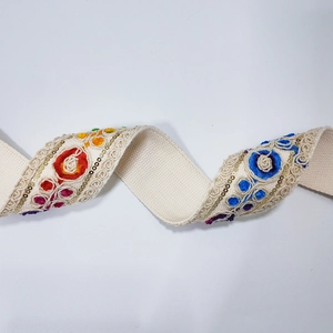 Detailed S-curve view of embroidered floral lace strap with colorful sequins and sequins