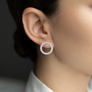 Elegant 925 sterling silver hoop earrings set with sparkling cubic zirconia on model