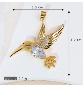 Detailed view of hummingbird pendant with dimensions 3.3cm by 3.9cm and weight 5.1g