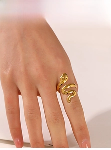 Detail of an 18K gold-plated stainless steel snake ring worn on a finger
