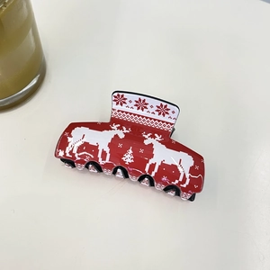 Christmas hair claw clip with red reindeer and snowflake patterns on white background