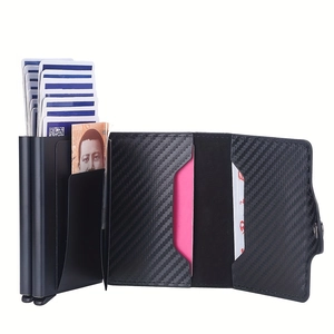 Detail of carbon fiber RFID wallet showing automatic pop-up mechanism and card slots