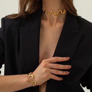 Elegant 18k gold plated stainless steel wave necklace and bracelet set on model