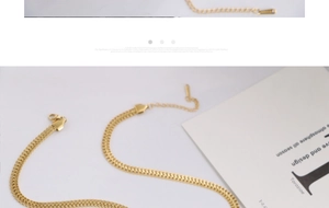 Detail of golden herringbone chain necklace featuring a secure lobster clasp and extension
