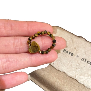 Handcrafted tiger eye beaded heart ring with golden accents and natural stone texture