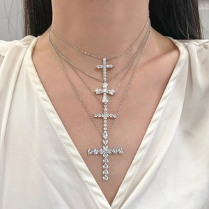 S925 Sterling silver cross necklace with sparkling white zircons worn by a model