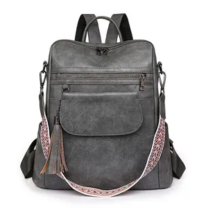 Retro grey PU leather backpack for women with bohemian strap and fringe detail