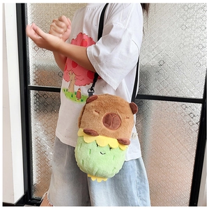 Detail of Capybara plush crossbody bag being worn to show texture and adjustable strap