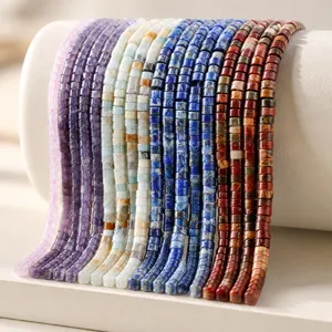 Macro shot of colorful 3mm faceted natural stone beads including amethyst and garnet