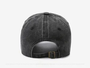 Detail view of the vintage washed black baseball cap with adjustable metal buckle back