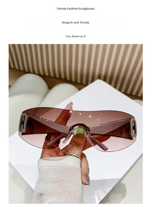 Close-up of luxury rimless Y2K sunglasses featuring a rhinestone-studded F logo on the side