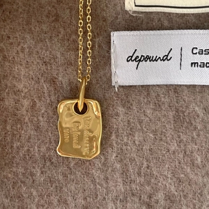Minimalist gold plated 925 silver necklace with textured irregular letter pendant on wool