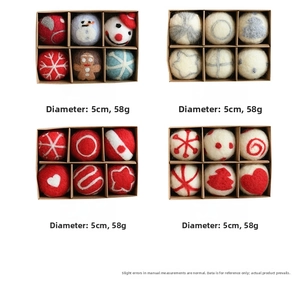 Detail view of 5cm handmade wool felt Christmas balls with snowman and tree patterns