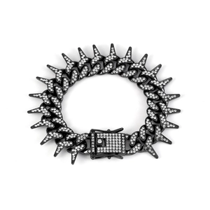Detail of black Cuban link bracelet with sharp spikes and pave-set rhinestones