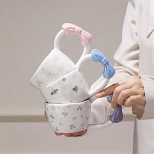 Ceramic mugs set with colorful butterfly-shaped handles and cute cartoon patterns