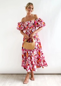 Detail of smocked bodice and puff sleeves on floral print off-shoulder maxi dress