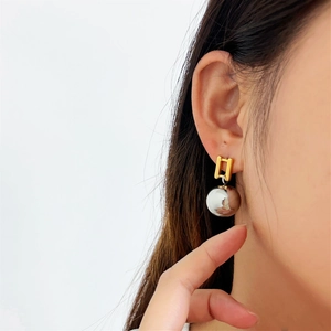 Two-tone minimalist earrings with gold rectangle stud and silver mirror sphere drop