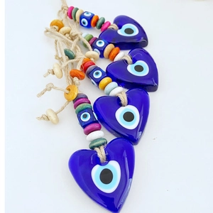 Set of four blue glass heart Evil Eye pendants with colorful beads and hemp ropes