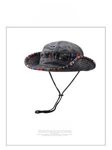 Detail of grey washed cotton bucket hat with colorful bohemian ethnic ribbon and chin strap