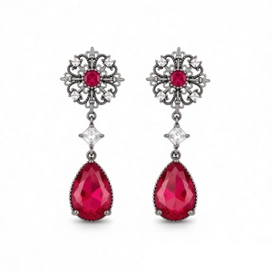 Vintage silver-tone drop earrings with hollow flower design and deep red teardrop crystals