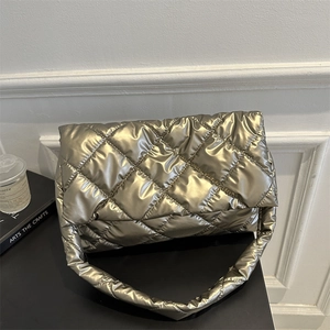 Golden quilted shoulder bag with soft metallic finish and stylish wide strap