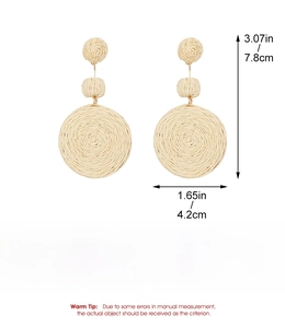 Detail view of woven raffia flower earrings showing size 7.8cm height and 4.2cm width