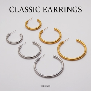Classic gold and silver C-shaped hoop earrings in three sizes on white background