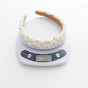French retro tweed headband weighing 26.4g on a digital scale for material quality