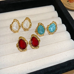 Vintage teardrop resin earrings in red, pearl white, and blue with gold lava texture