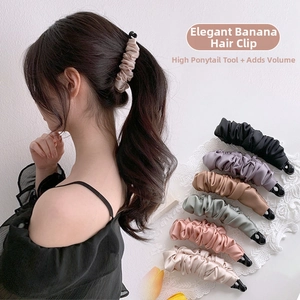 Detail of satin bow banana clips showing elegant pleated texture and multiple color options