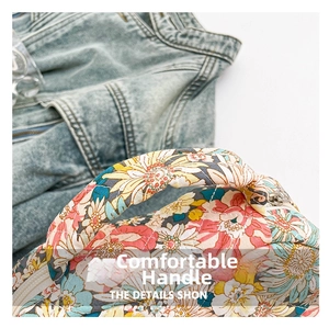 Detail of comfortable quilted cotton handle with vibrant floral pattern and soft texture