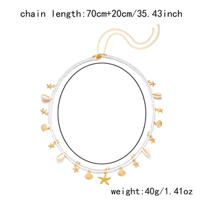 Detail showing shell and starfish pendants on beaded waist chain with size and weight info