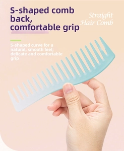 Detail of ergonomic S-shaped mint green wide tooth comb for scalp massage and hair styling