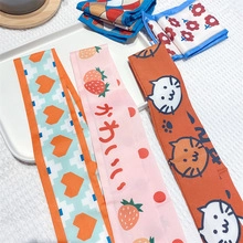 Satin skinny scarves featuring pink strawberry, cartoon cat and geometric patterns