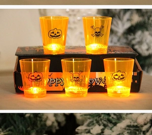 Detail of 12pcs Halloween LED shot glasses featuring pumpkin and skull glowing designs