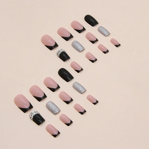 Long square black French press-on nails with silver glitter and rhinestone accents