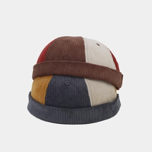 Retro colorblock corduroy docker hats for men and women featuring vintage patchwork design