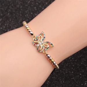 Detailed view of adjustable butterfly bracelet with colorful zircon inlay on model wrist