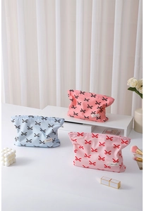 Variety of cotton cosmetic bags with bow patterns in pink and blue colors