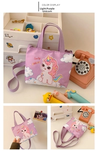 Detail showing lavender canvas kids messenger bag with lucky unicorn print and strap