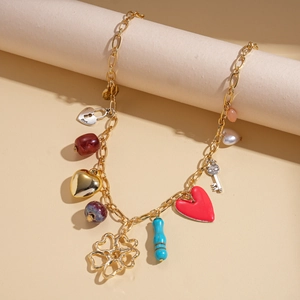 Detail of two-piece layered necklace featuring resin heart charms and diverse beaded elements