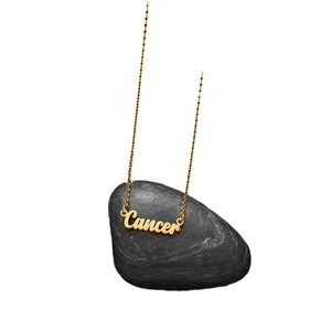 Golden Cancer zodiac necklace with vintage art font pendant on a black stone