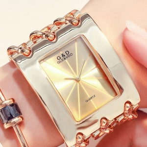 Close-up of rose gold square watch for women with luxury three-chain strap on wrist
