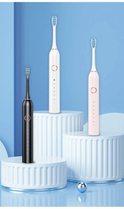Professional display of sonic electric toothbrushes in black, white, and pink finishes