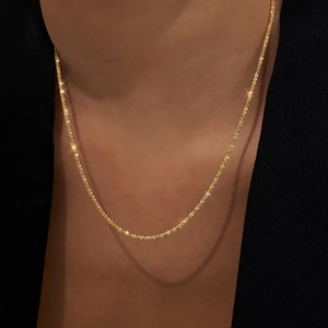 Sparkling gold-plated stainless steel star chain necklace for women on a model