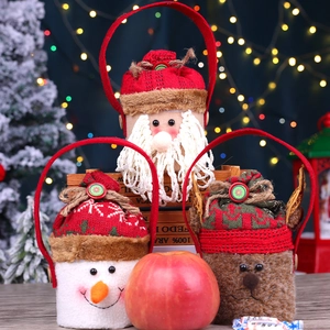 Three festive felt Christmas treat bags featuring Santa, Snowman, and Reindeer characters