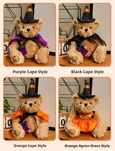 Macro shot of Halloween teddy bears with witch hats and embroidered pumpkin details
