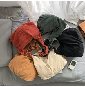 Detailed top view of minimalist corduroy tote bags in five different autumn colors