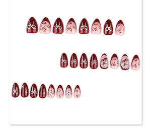 Detailed set of 24 almond press-on nails with cherry pearls and bow heart patterns